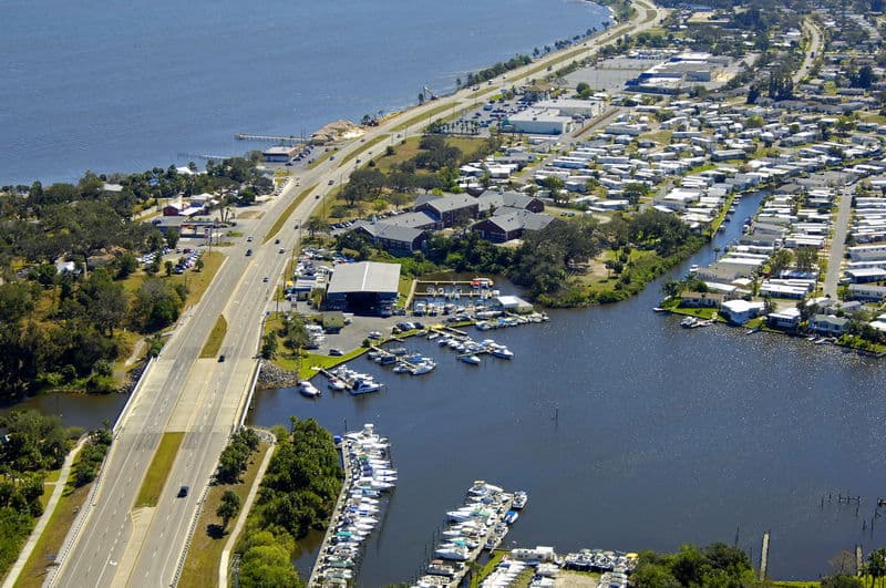 Roll off dumpster placed beside Palm Bay home during major renovation cleanup